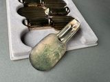 a silver spoon and a silver spoon in a box