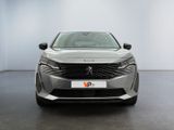 the front view of a silver car in a white room