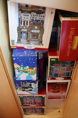 a small cabinet with a lot of toys inside of it
