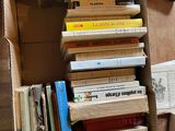 a box full of books sitting on the floor