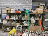a pile of assorted items on the floor in a garage