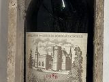 a bottle of wine in a wooden box on a table