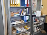 many files and folders on the shelves in the office