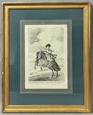 an old picture of a man riding a horse in a gold frame