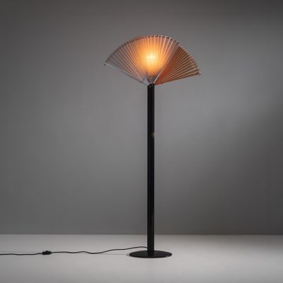 a lamp that is on a table with a light on it