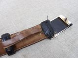 a belt with a cell phone attached to it