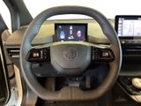 the interior of a car with a steering wheel and a touch screen