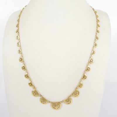 a gold necklace on a mannequin mannequin mannequin mannequin mannequin mannequin mannequin mannequin mannequin