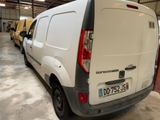 a white van that is parked in a garage