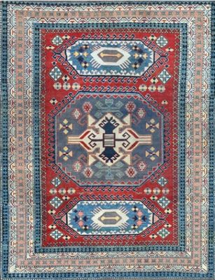 a red, blue and green rug with geometric design