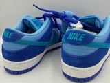 a pair of blue and white sneakers with blue laces