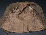 an image of a brown jacket with a hood on a black background