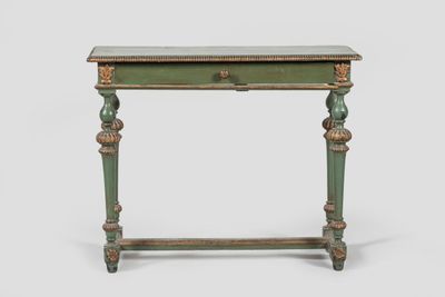 a green table with a drawer on top of it on a white surface
