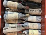 many bottles of wine in a box on the table