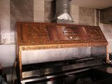a large metal grill in the middle of a kitchen