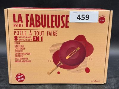 the box of a red pan with a wooden spatula on it