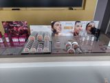 a display of cosmetics products on a table in a store