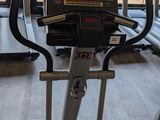 a row of treads in a gym with a view of the mountains