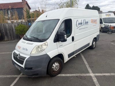 a white van that is parked in a parking lot
