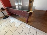a pool table in the middle of a tiled floor