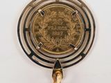 an image of a gold coin on top of a lighter