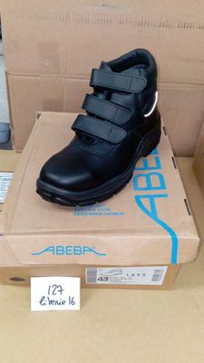 a box with a pair of black shoes on top of it