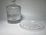 a clear glass jar with a lid on a table
