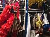a room with a lot of clothes on display in it