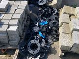 a pile of concrete blocks on the ground next to a pile of concrete blocks