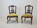 pair of antique chairs with upholstered back and upholstered seat
