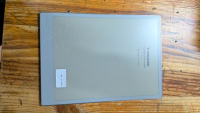 a tablet computer sitting on top of a wooden table