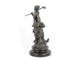 an image of a statue of a woman with a sword on a pedestal