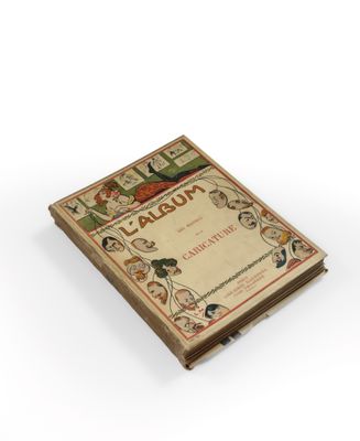 an old book sitting on top of a white surface