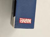 a blue wallet with a red and white sticker on it