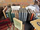 a lot of books that are on a table