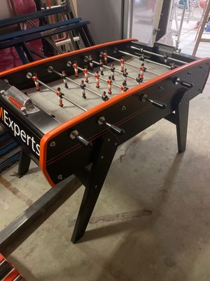 a foosball table in the middle of a room