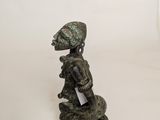 figurine of a woman with an umbrella on a white background