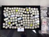 a tray of cell phones that are sitting on a table