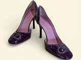purple high heel shoes with a black heel and a purple heel