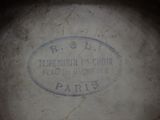 a close up of a plate with a stamp on it