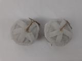 two cupcakes that are sitting on a white table