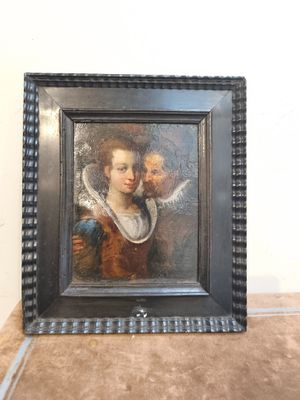 tableau représentant une femme tenant un enfant dans ses bras, dans un cadre noir
