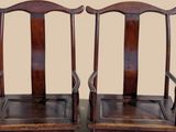 pair of antique chinese chairs with wooden seats and arms