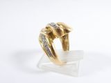 an image of a gold and diamond ring on a clear acrylic stand