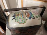 a vase with a lid sitting on a table