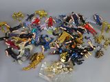 a lot of toy figurines that are on a table