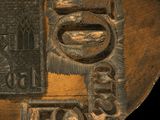 an image of a piece of art with a plaque on it