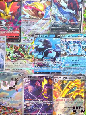 a lot of pokemon cards on display on a table