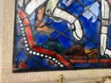 a picture of a painting on the wall of a bathroom