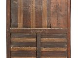 an old wooden cabinet with two doors and a drawer underneath it